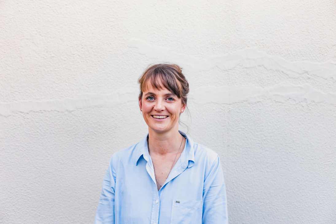 Professional Headshot of a White woman on a minimal background