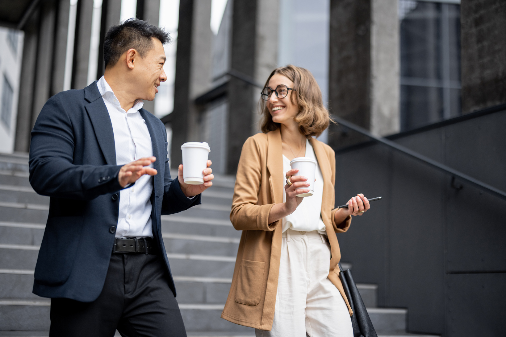 Colleagues Walking to Work with Coffee